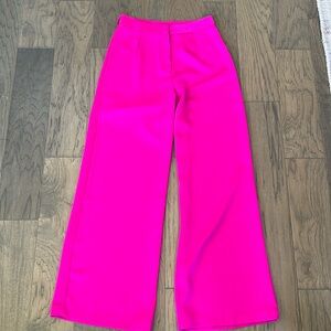 A peach bright pink trouser pants s
